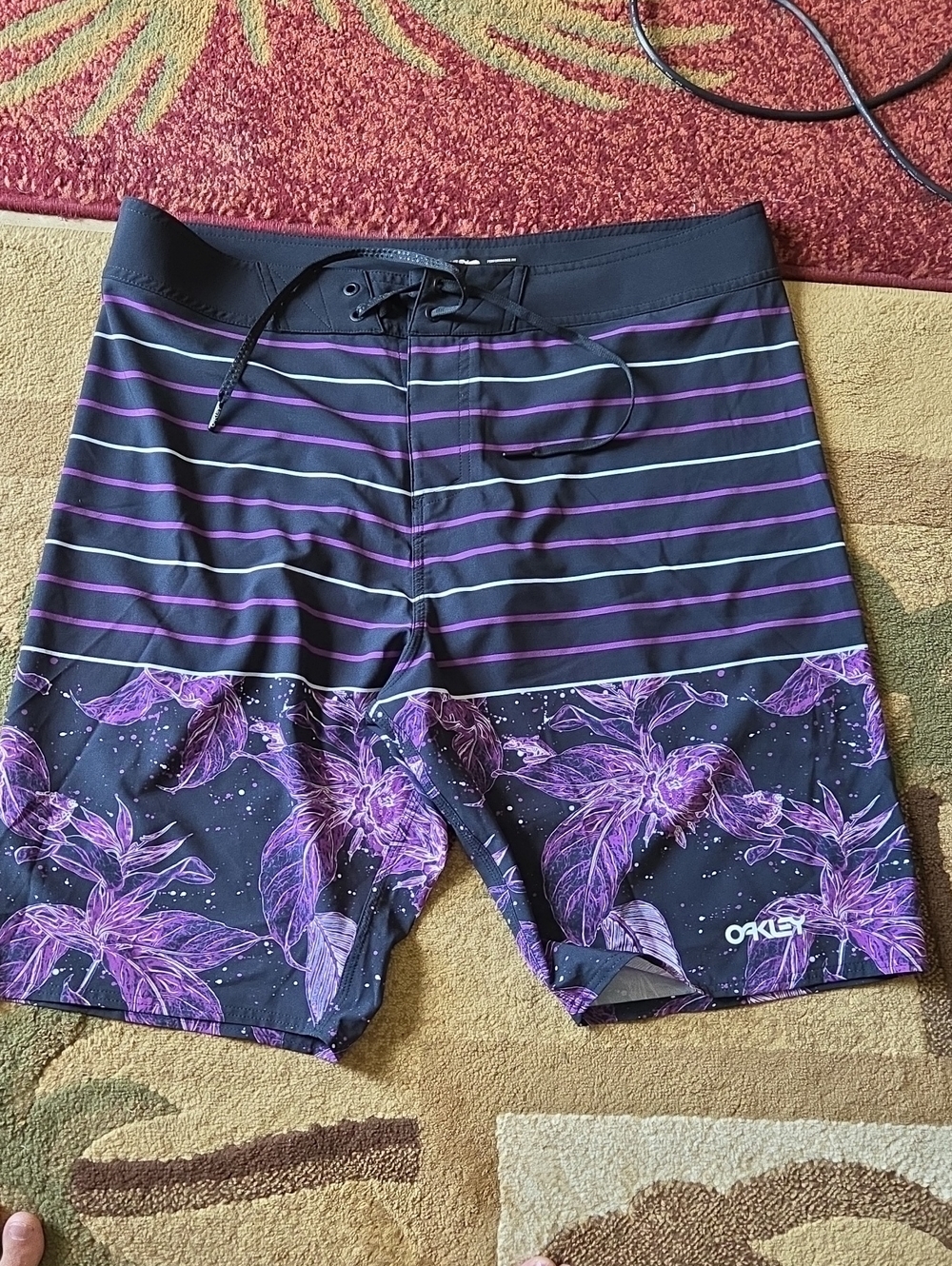 Euc! Oakley Sz 38 Men’s Black and Purple Floral Stripe Board Shorts